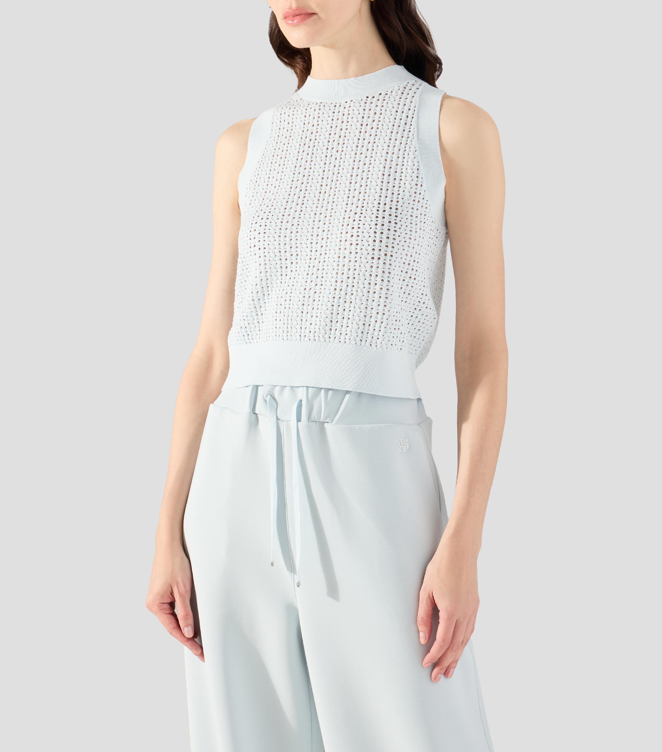 Blusa lisa sin mangas Mujer